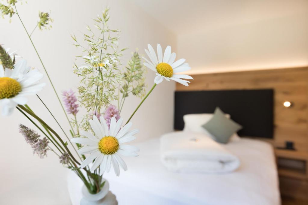 Postel nebo postele na pokoji v ubytování Boutique-Hotel Vincenz