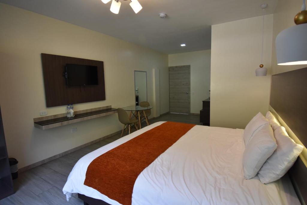 Postel nebo postele na pokoji v ubytování Monte Selva Hotel Spa Termal