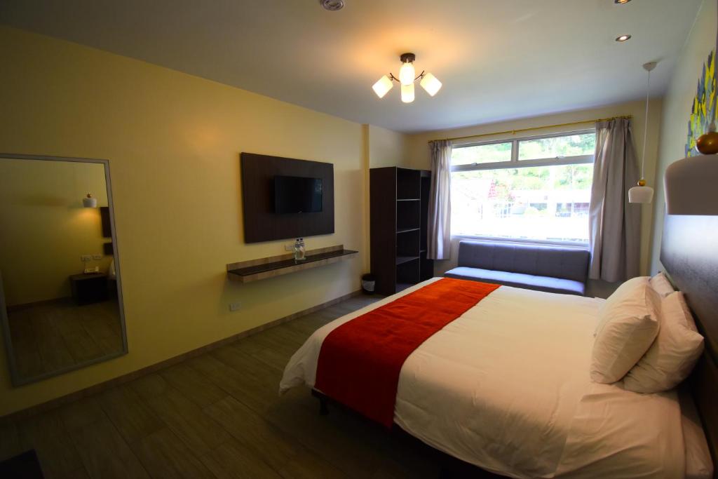 Postel nebo postele na pokoji v ubytování Monte Selva Hotel Spa Termal