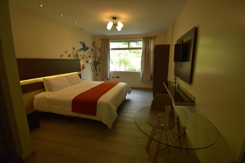 Postel nebo postele na pokoji v ubytování Monte Selva Hotel Spa Termal