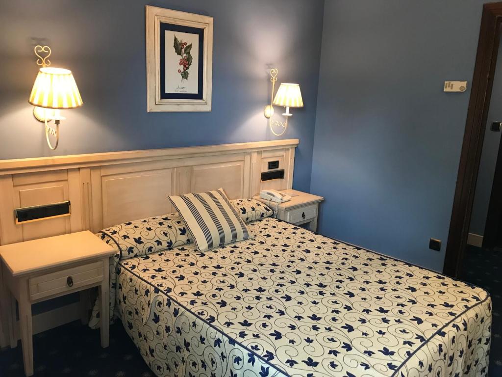 Postel nebo postele na pokoji v ubytování Hotel Leonor Mirón