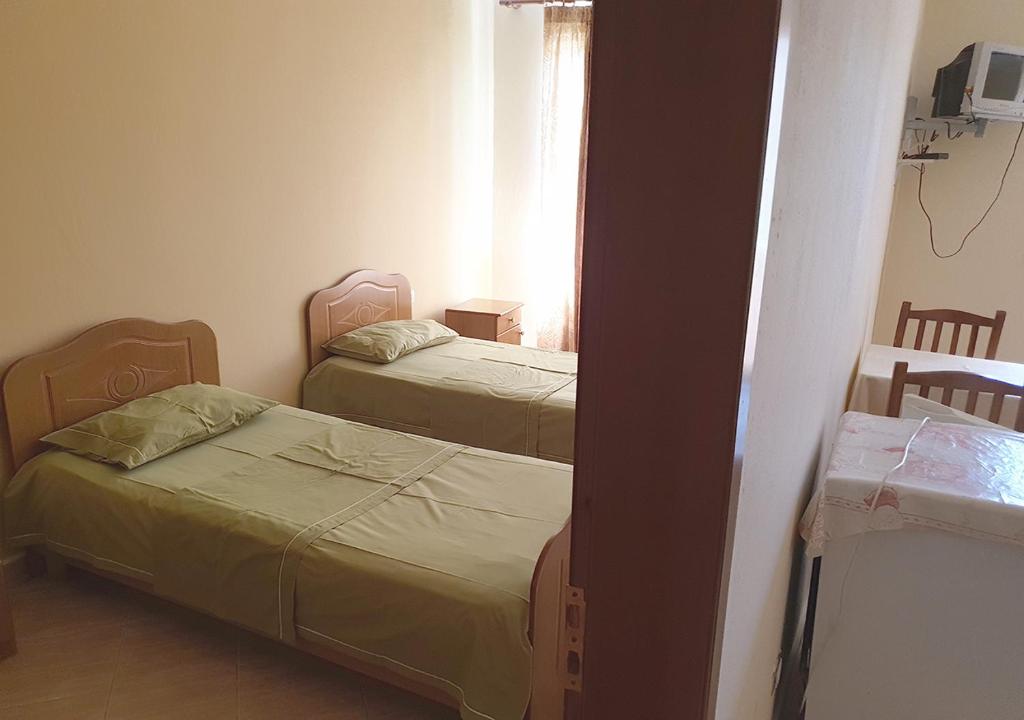 Postel nebo postele na pokoji v ubytování Hotel Palma