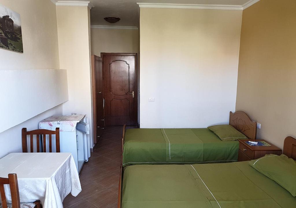 Postel nebo postele na pokoji v ubytování Hotel Palma