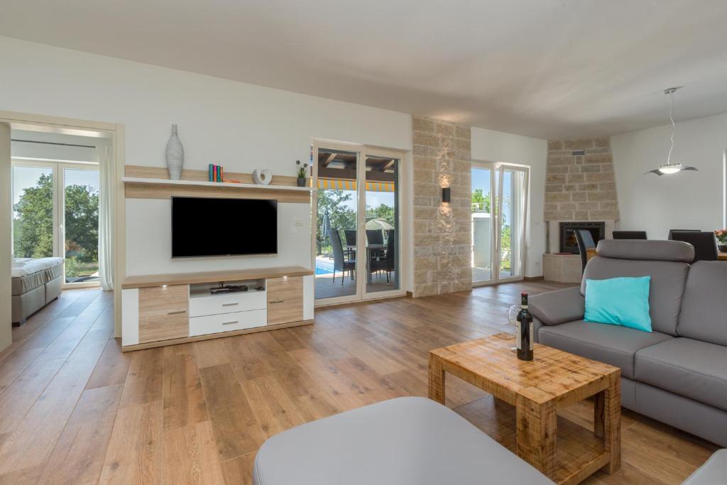 Telewizja i/lub zestaw kina domowego w obiekcie Villa Laura An