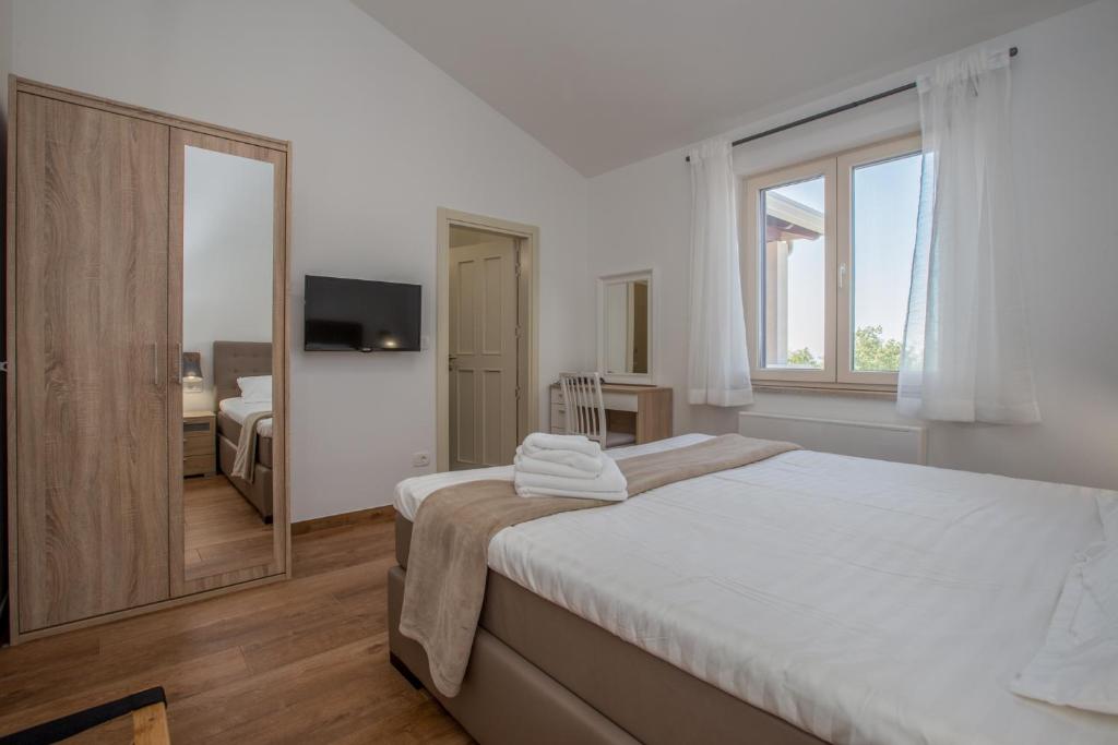 Łóżko lub łóżka w pokoju w obiekcie Villa Laura An