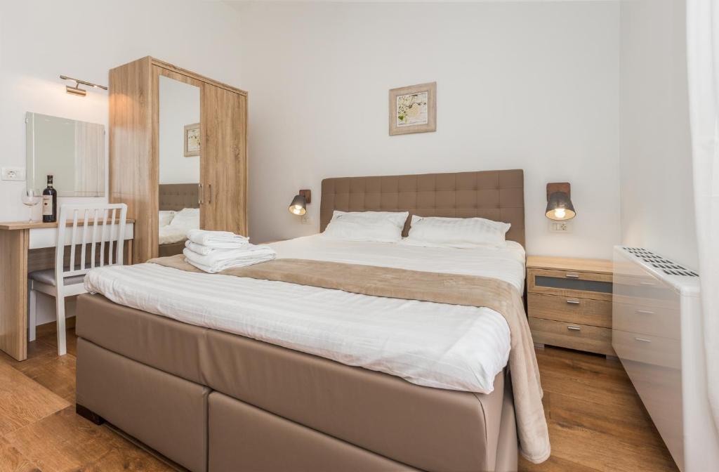 Łóżko lub łóżka w pokoju w obiekcie Villa Laura An