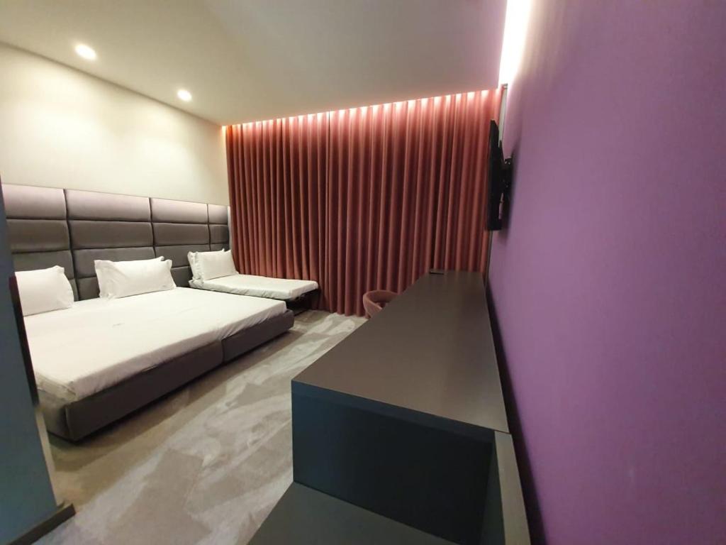 Postel nebo postele na pokoji v ubytování Albes Hotel