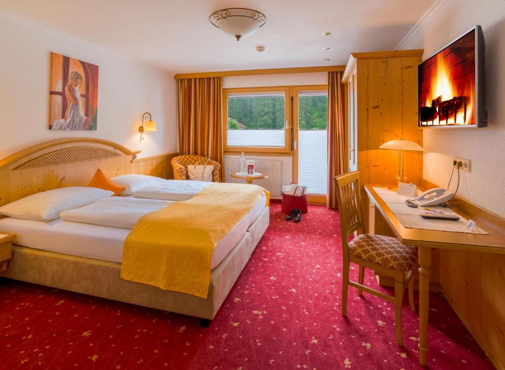 Katil atau katil-katil dalam bilik di Hotel-Garni Jakober