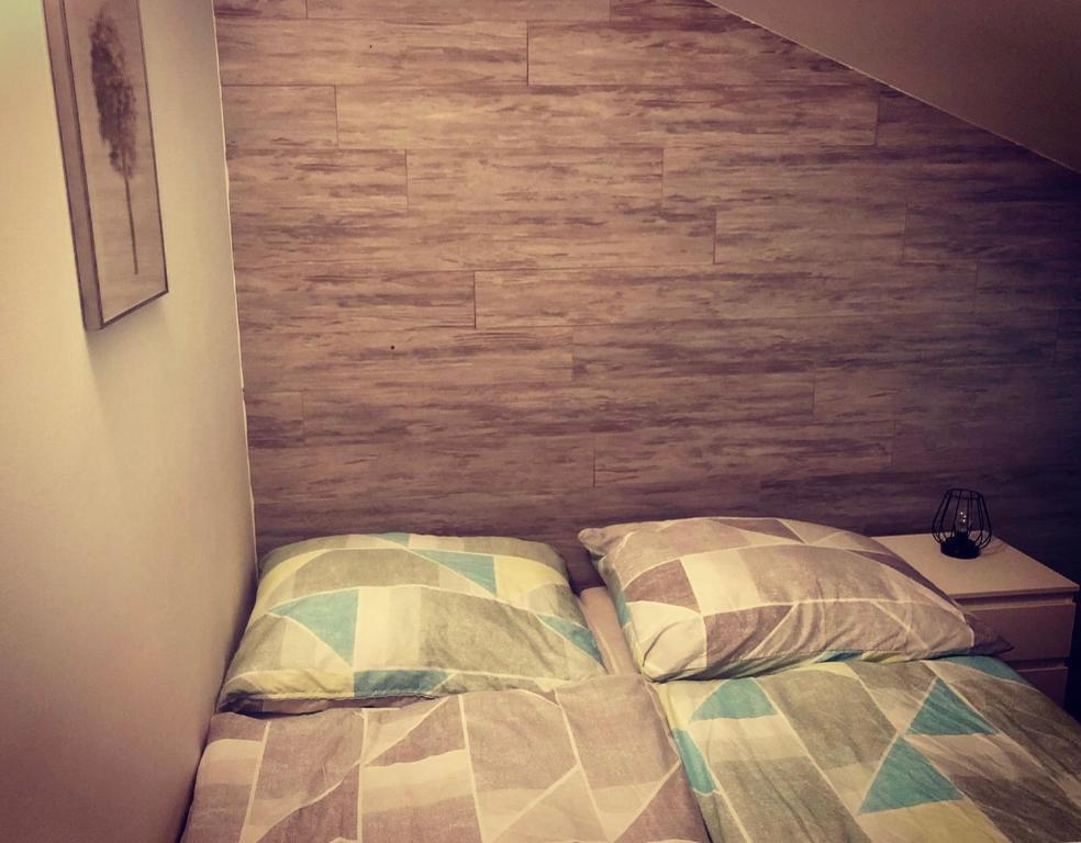 Postel nebo postele na pokoji v ubytování Cihlářka - horský apartmán