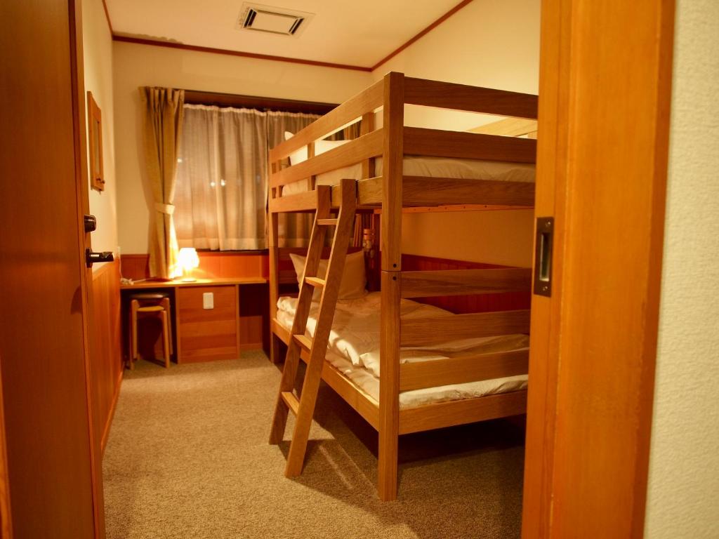 Postel nebo postele na pokoji v ubytování Okushiga Lodge Yama no Manimani