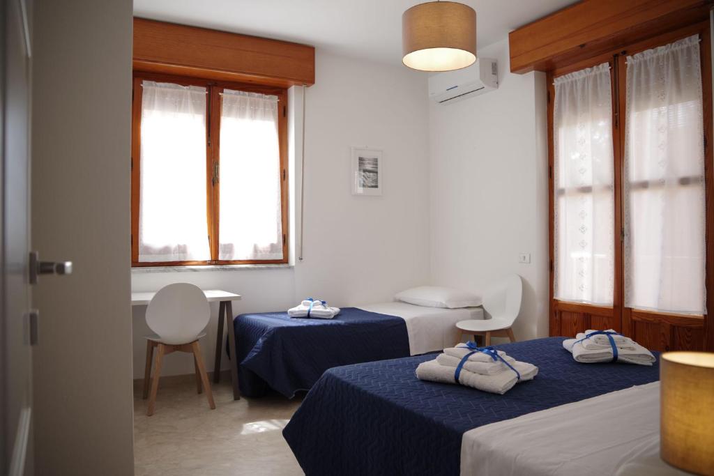 Postel nebo postele na pokoji v ubytování Corsaro B&B