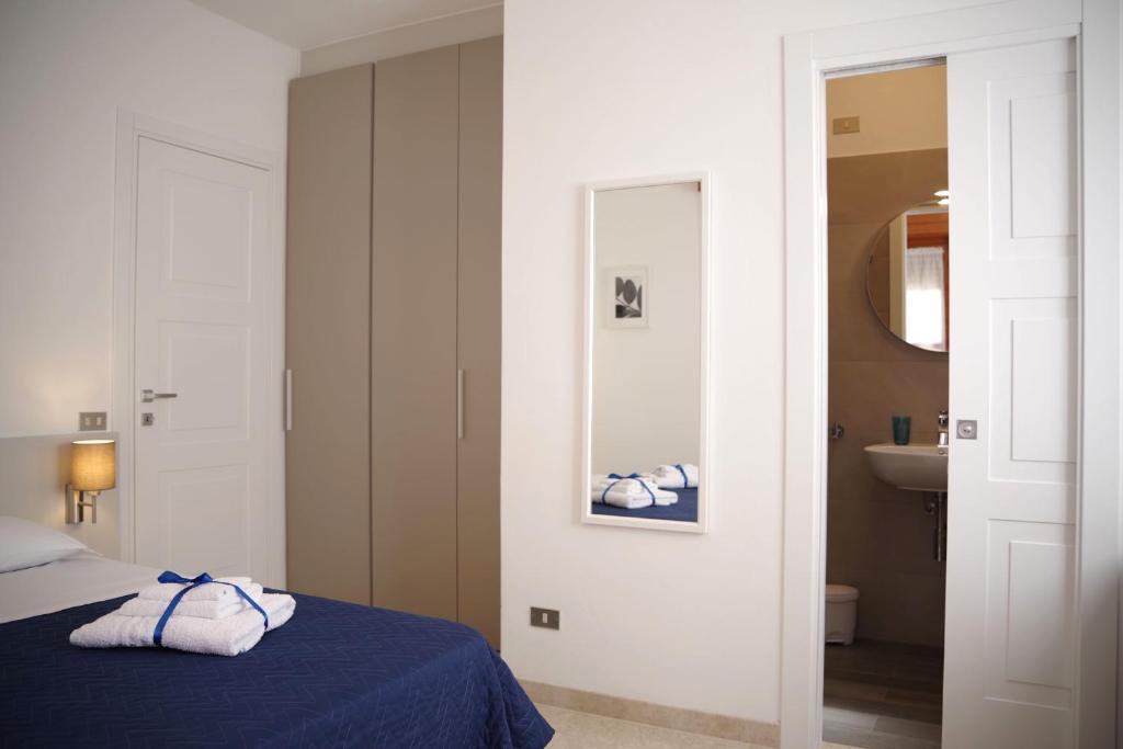 Postel nebo postele na pokoji v ubytování Corsaro B&B