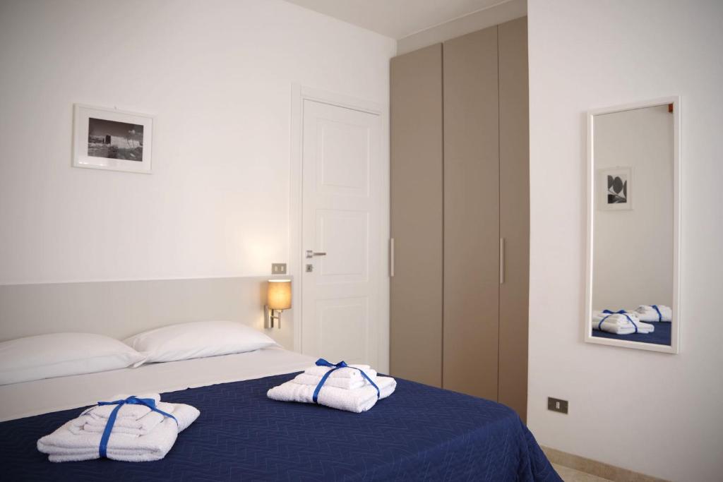 Postel nebo postele na pokoji v ubytování Corsaro B&B