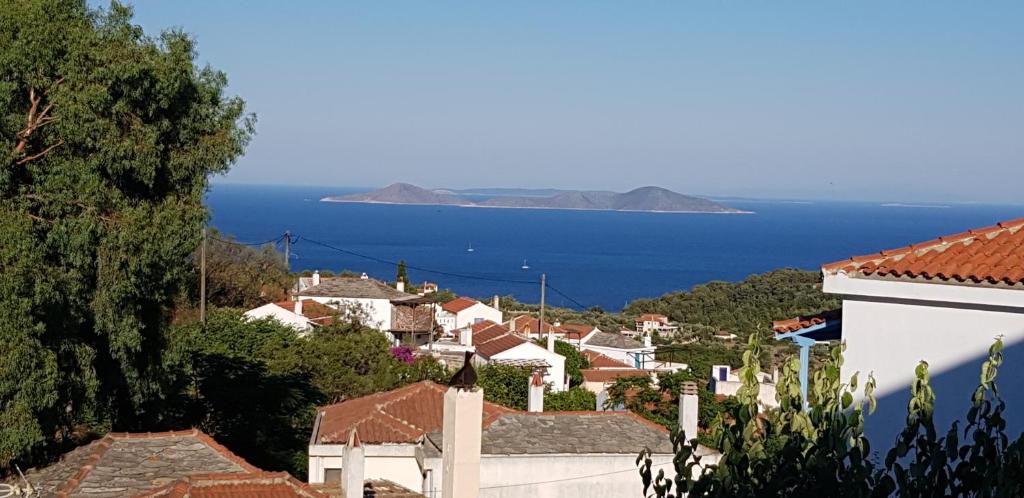 a view of a town with the ocean in the background at Fantasia House in Alonnisos Old Town
