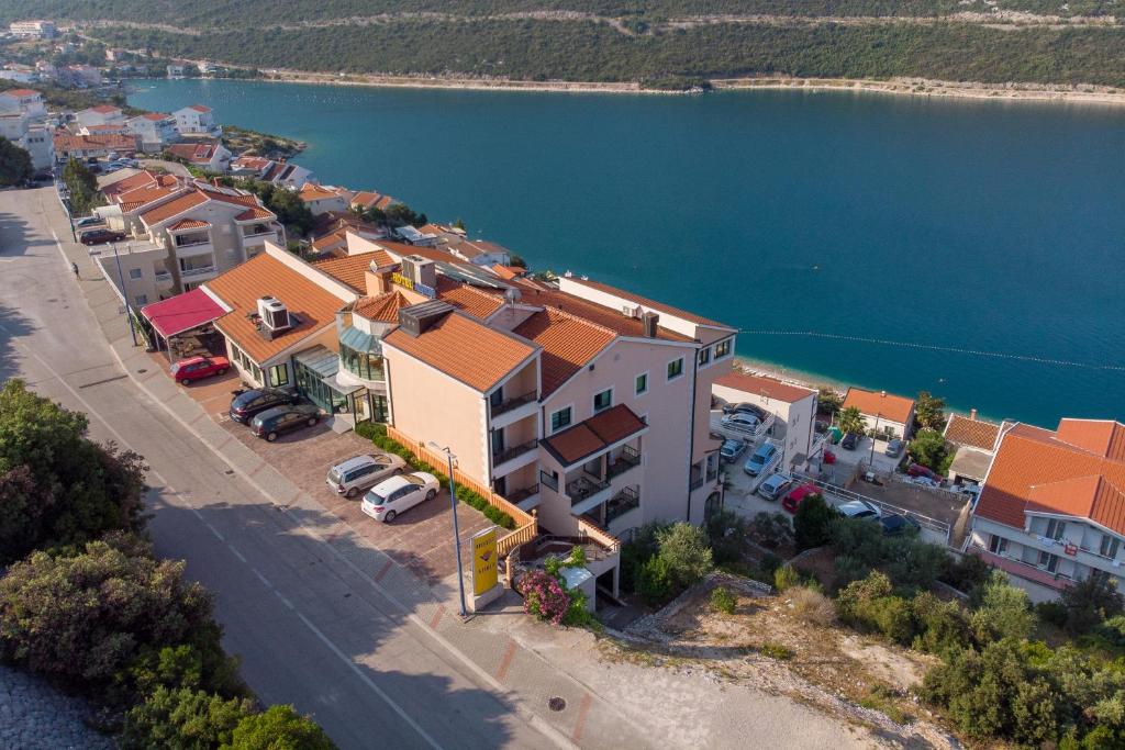 an aerial view of a small town by the water at Hotel Adria in Neum
