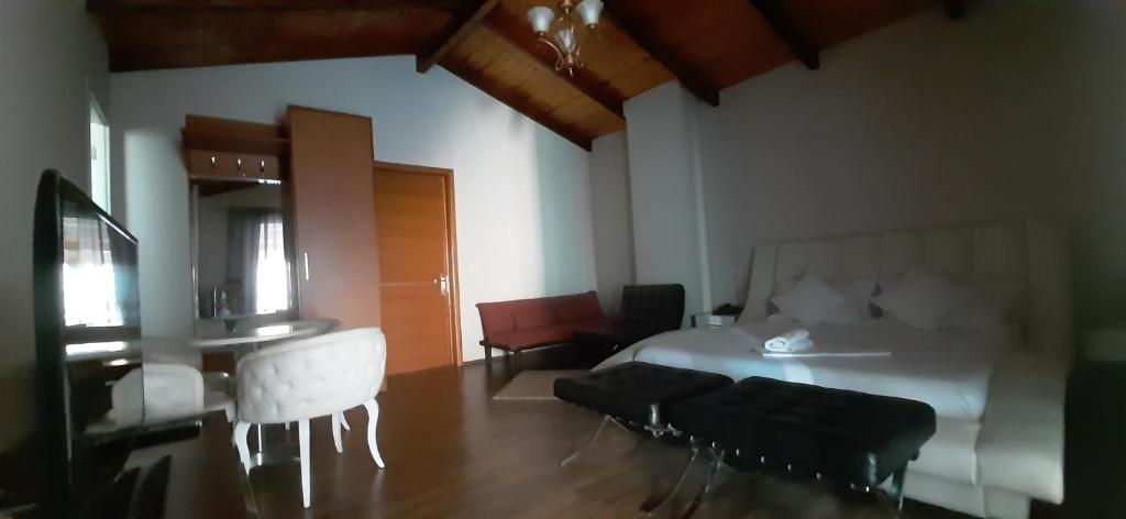 Postel nebo postele na pokoji v ubytování Hotel Bylis