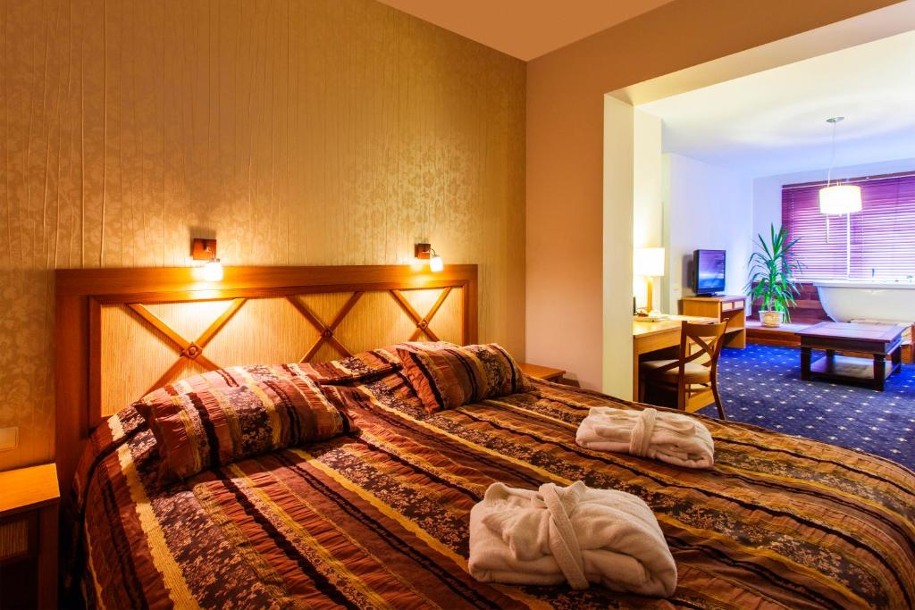 Postel nebo postele na pokoji v ubytování Park Villa Hotel