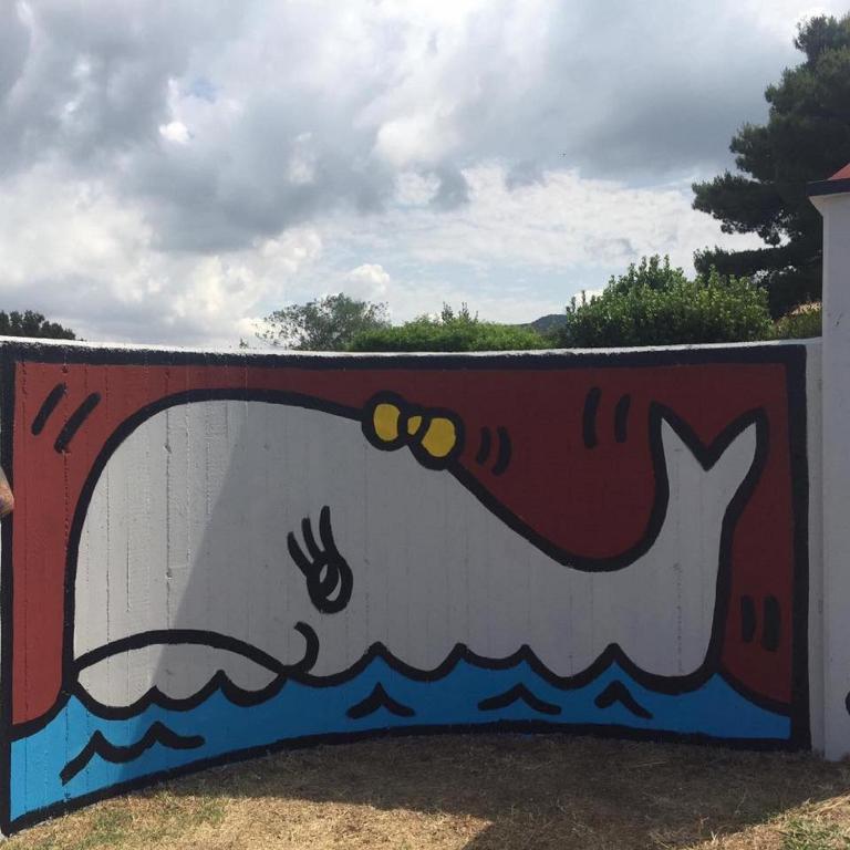 a wall with a painting of a whale on it at Villa Liburnia in Livorno