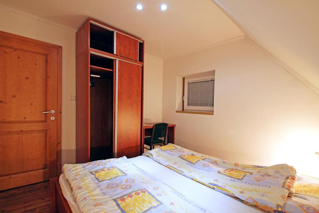 A bed or beds in a room at Privat Lucia