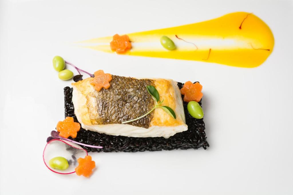a piece of food on a plate with a banana at Alchymist Grand Hotel and Spa - Preferred Hotels & Resorts in Prague