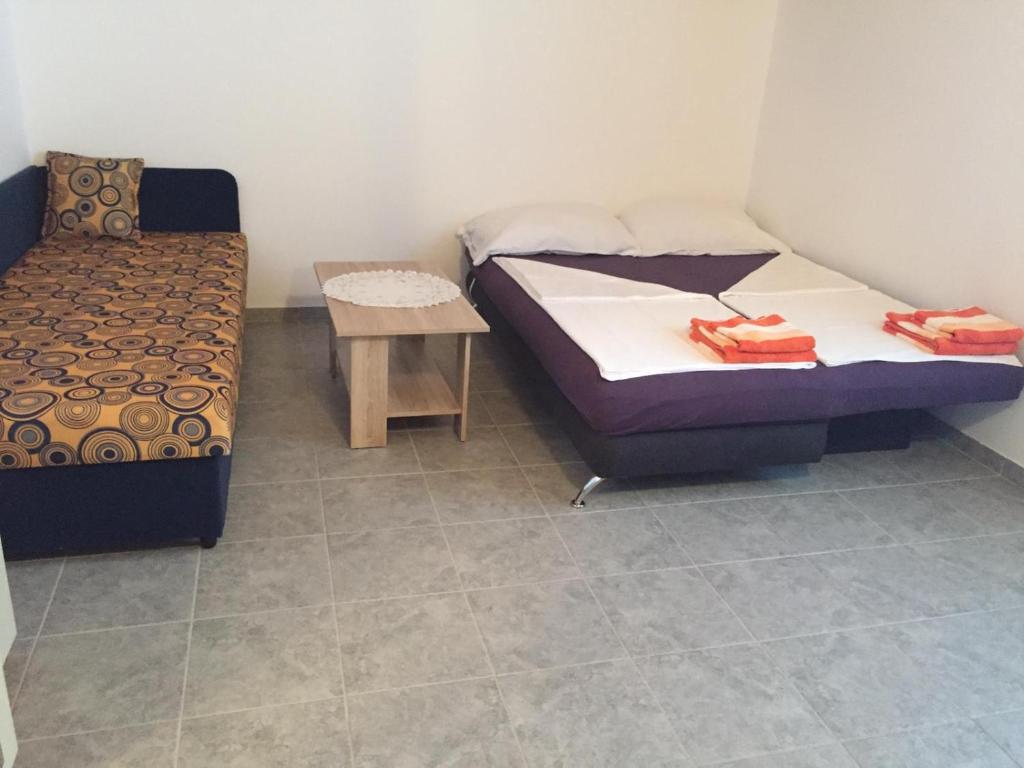 Posteľ alebo postele v izbe v ubytovaní Apartmani Atila Damir