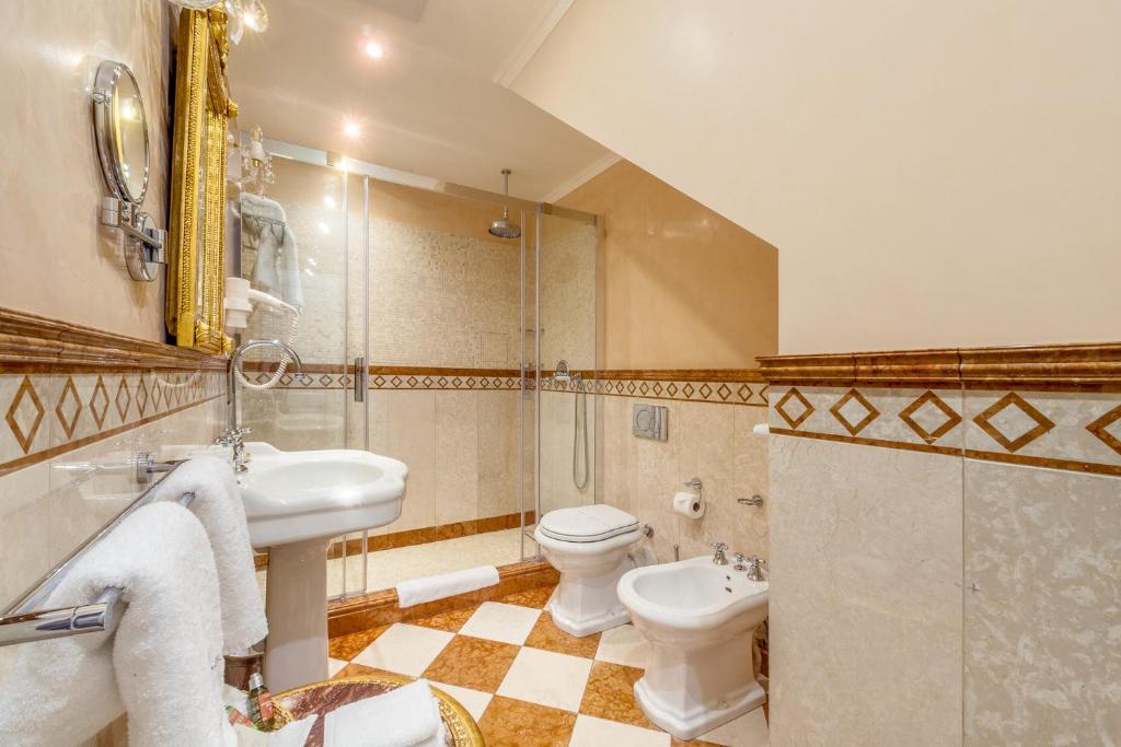 a bathroom with a sink and a toilet and a shower at Alchymist Grand Hotel and Spa - Preferred Hotels & Resorts in Prague