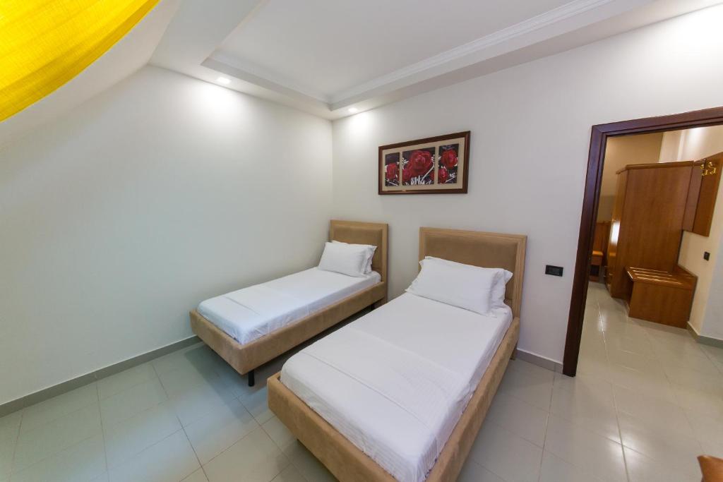 Postel nebo postele na pokoji v ubytování Western Star Hotel