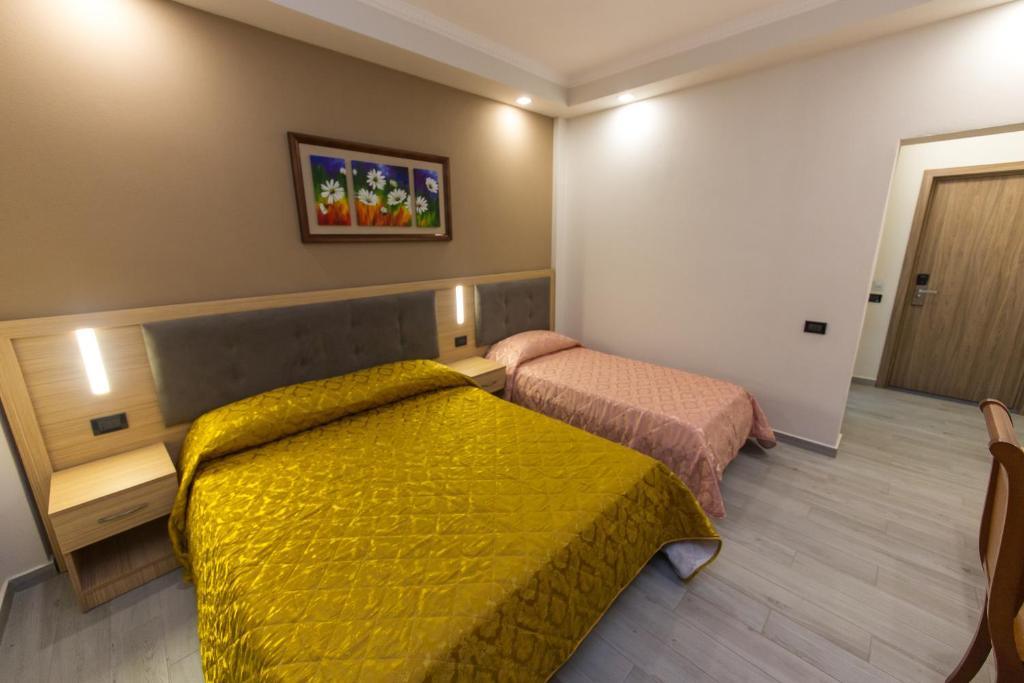 Postel nebo postele na pokoji v ubytování Western Star Hotel