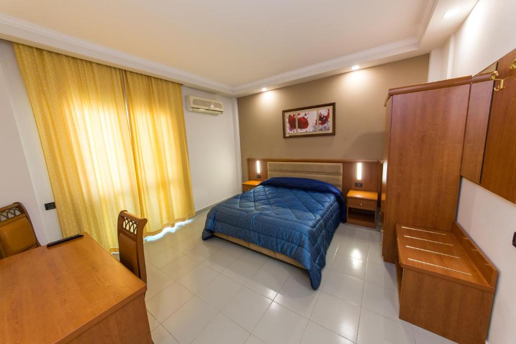Postel nebo postele na pokoji v ubytování Western Star Hotel
