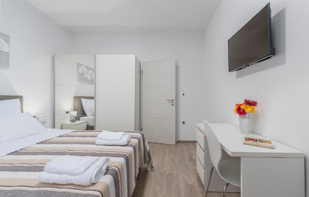 Postel nebo postele na pokoji v ubytování Apartments Vita