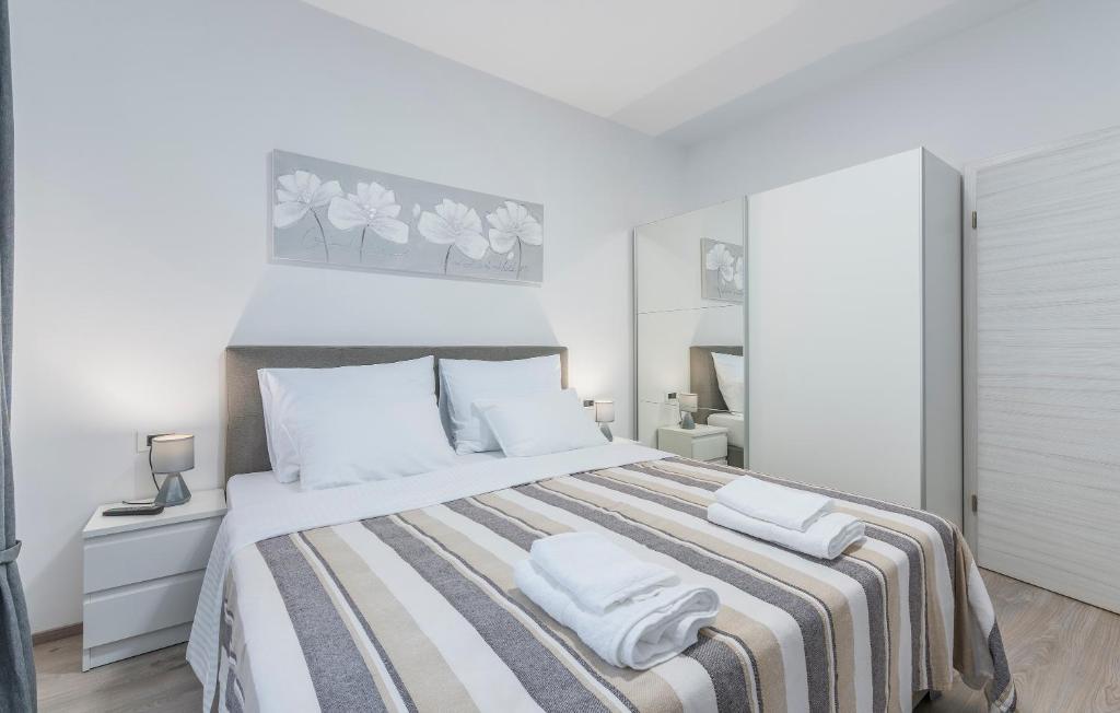 Postel nebo postele na pokoji v ubytování Apartments Vita