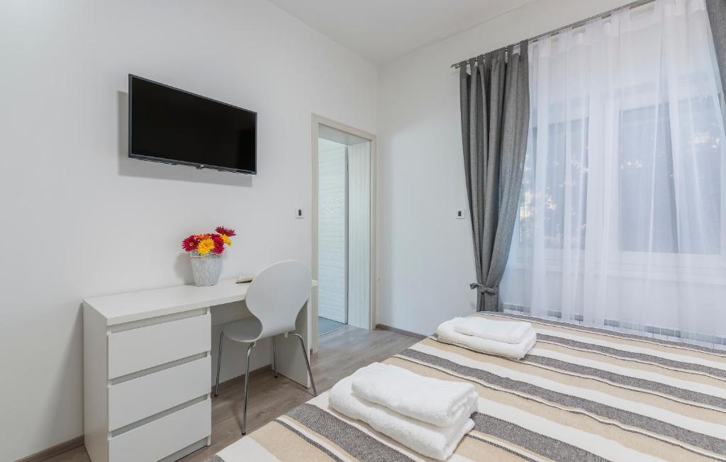 Postel nebo postele na pokoji v ubytování Apartments Vita