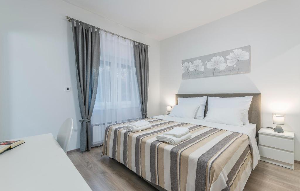Postel nebo postele na pokoji v ubytování Apartments Vita