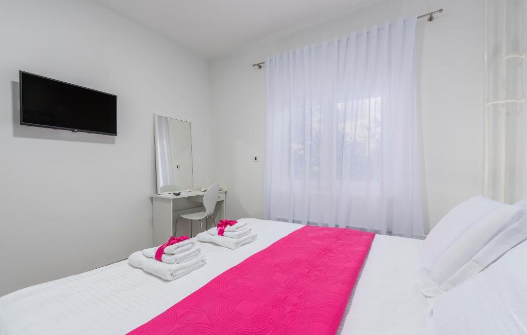 Postel nebo postele na pokoji v ubytování Apartments Vita