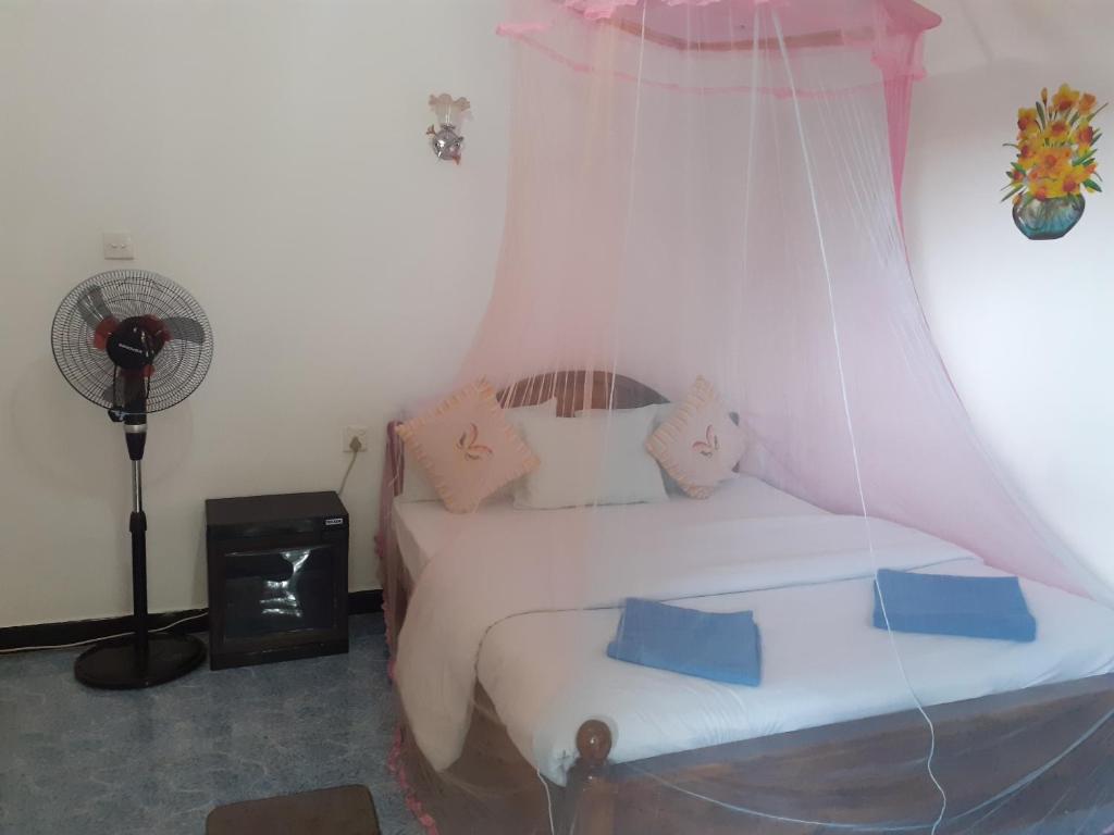Postel nebo postele na pokoji v ubytování Secret Nest Homestay