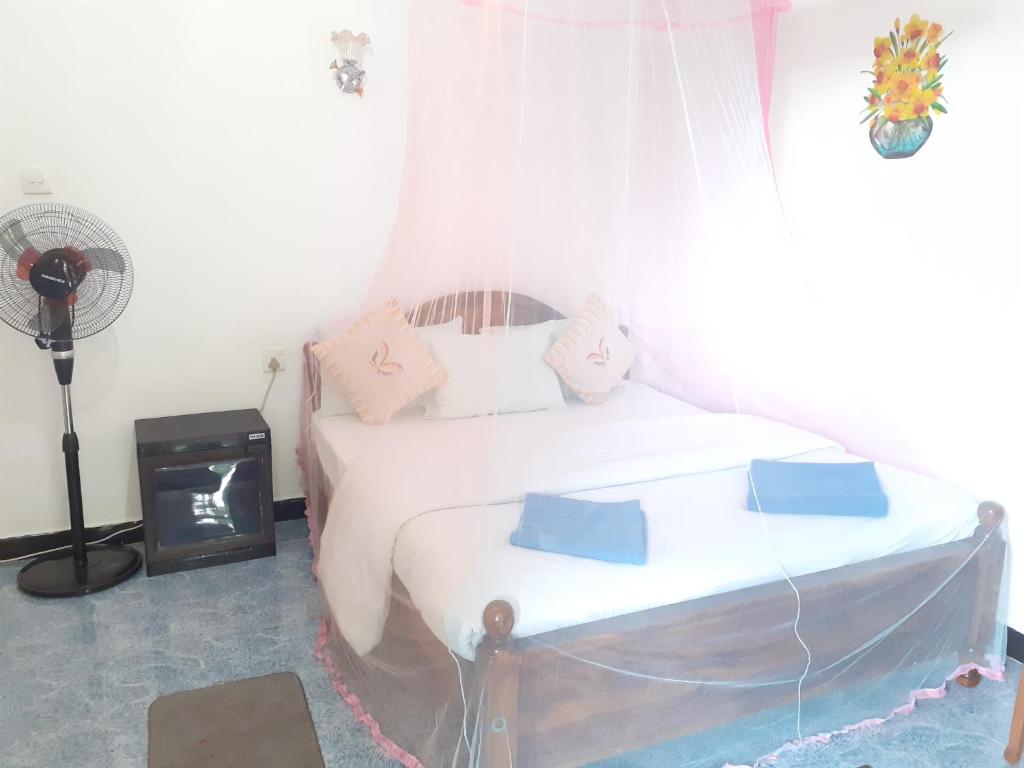 Postel nebo postele na pokoji v ubytování Secret Nest Homestay