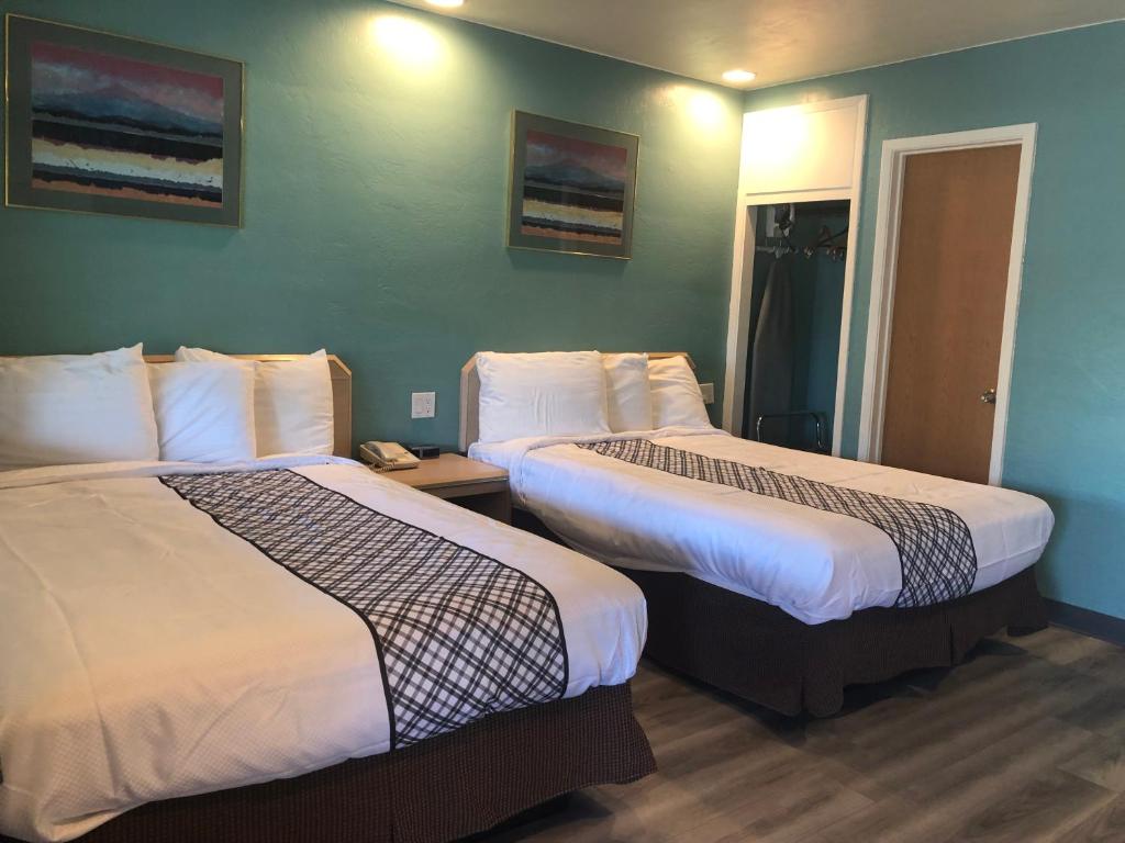 Postel nebo postele na pokoji v ubytování Bestway Inn