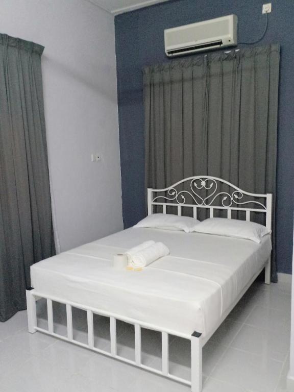 Postel nebo postele na pokoji v ubytování TEBiNG Guest House Taman Negara Malaysia Kuala Tahan