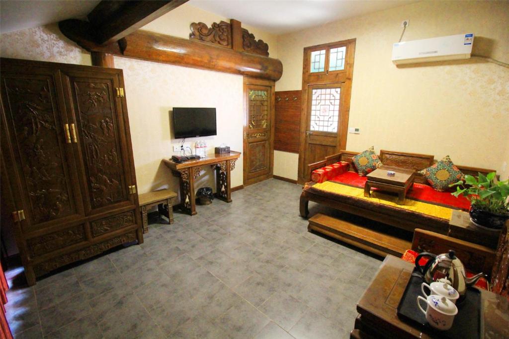TV a/nebo společenská místnost v ubytování Pingyao Hu lu wa Home Inn