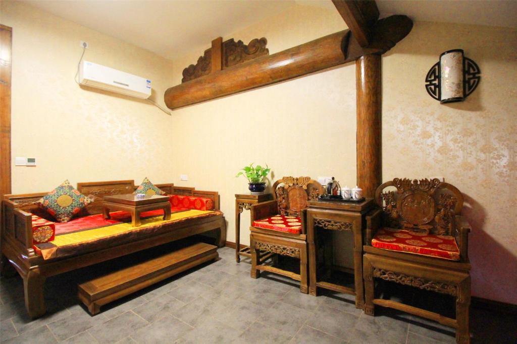 Postel nebo postele na pokoji v ubytování Pingyao Hu lu wa Home Inn