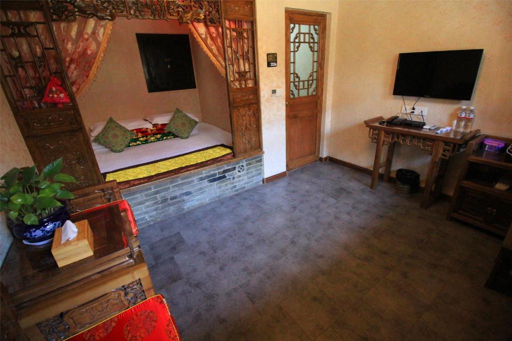 TV a/nebo společenská místnost v ubytování Pingyao Hu lu wa Home Inn
