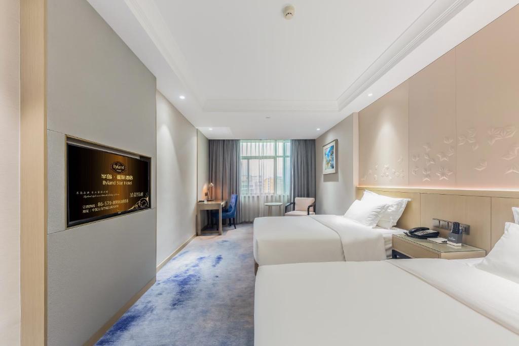 Postel nebo postele na pokoji v ubytování Byland Star Hotel