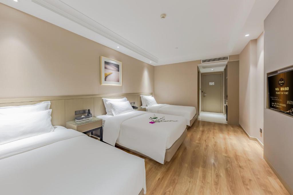 Postel nebo postele na pokoji v ubytování Byland Star Hotel