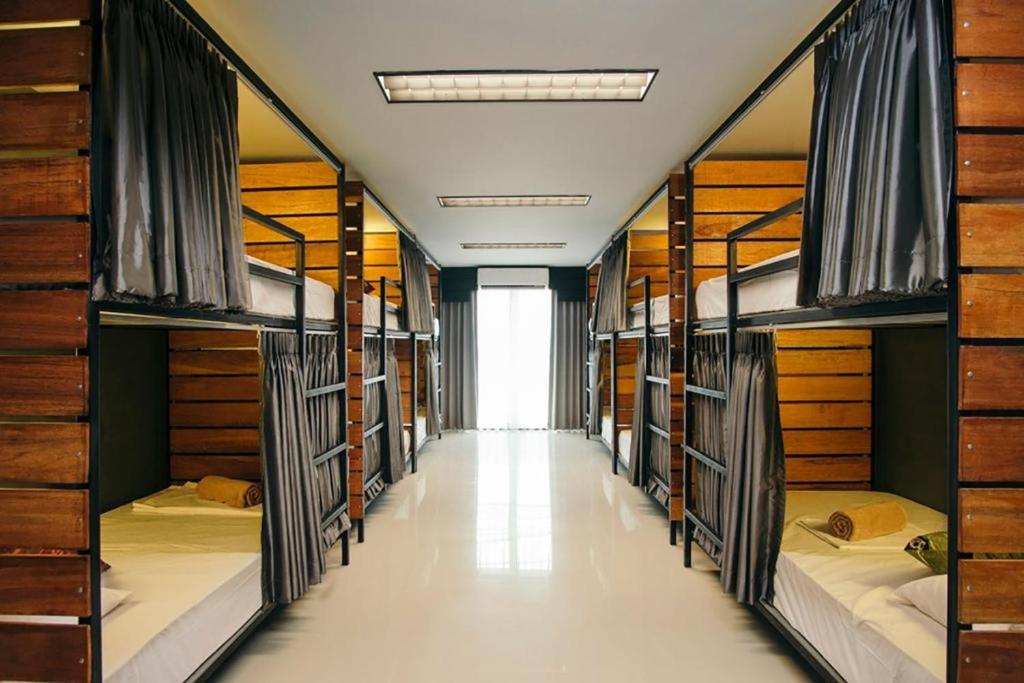 Postel nebo postele na pokoji v ubytování KoHabitat Samui