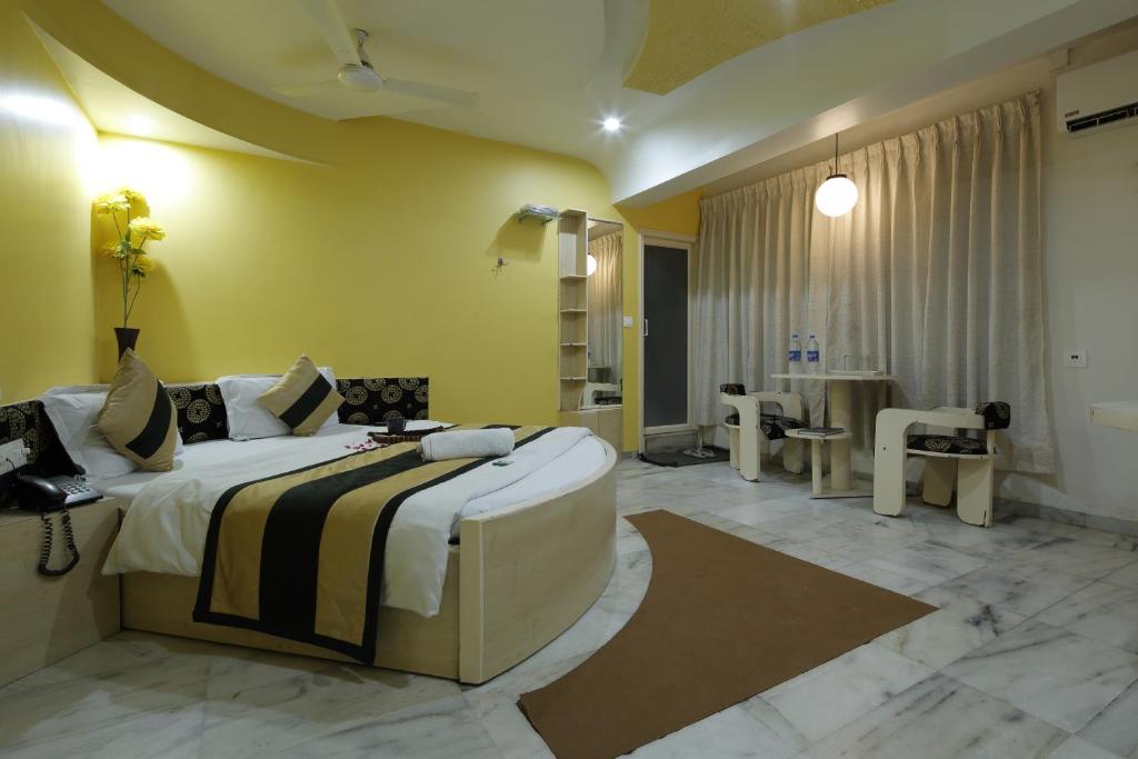 Postel nebo postele na pokoji v ubytování Hotel Volga