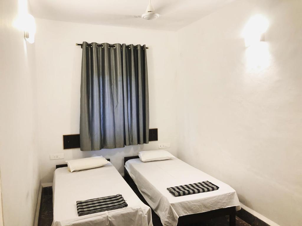 Postel nebo postele na pokoji v ubytování Hotel Paulino