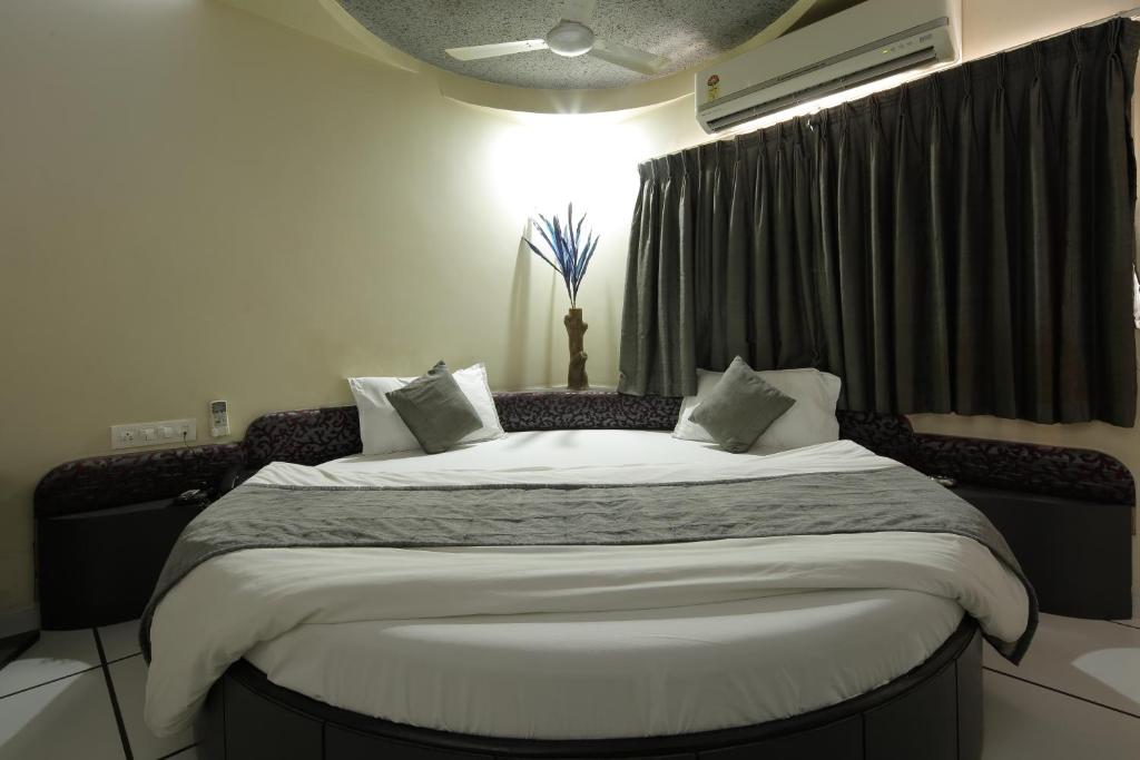 Postel nebo postele na pokoji v ubytování Hotel Volga