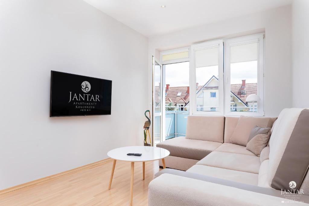 A seating area at Jantar Apartamenty - Park Side 2 Arciszewskiego