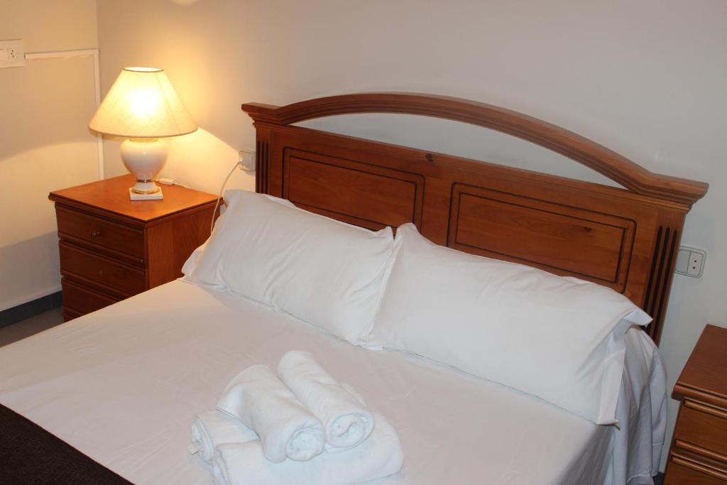 Postel nebo postele na pokoji v ubytování Hostal Los Maños