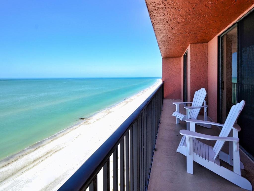 two chairs on a balcony looking out at the ocean at Madeira Towers 802 Renovated Madeira Towers Beachfront 2 Bedroom 2 Bathroom Condo 23143 in St Pete Beach